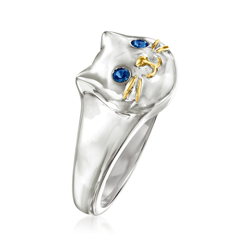 Sterling silver cat ring with blue gemstone eyes and gold-tone whiskers, side view