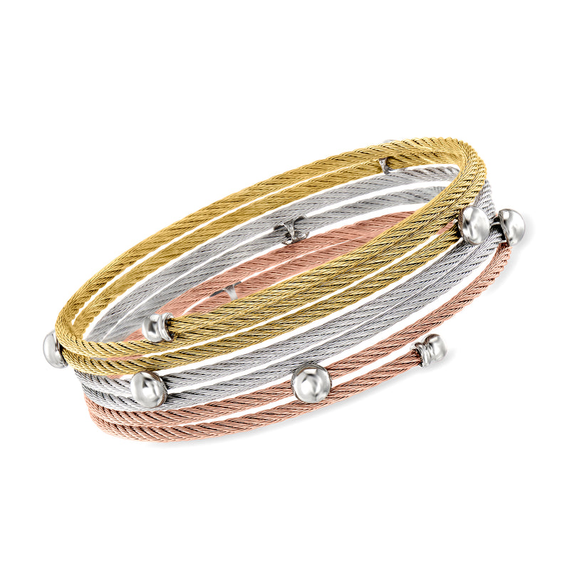 Tri-colored stainless steel cable coil bracelet with gold, silver, and rose strands; round bead ends