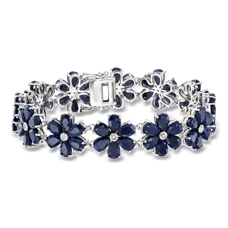 Sterling silver sapphire and diamond flower bracelet with blue oval gemstones