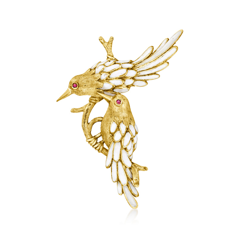 Vintage yellow gold bird pin with white enamel wings and red ruby eye accents