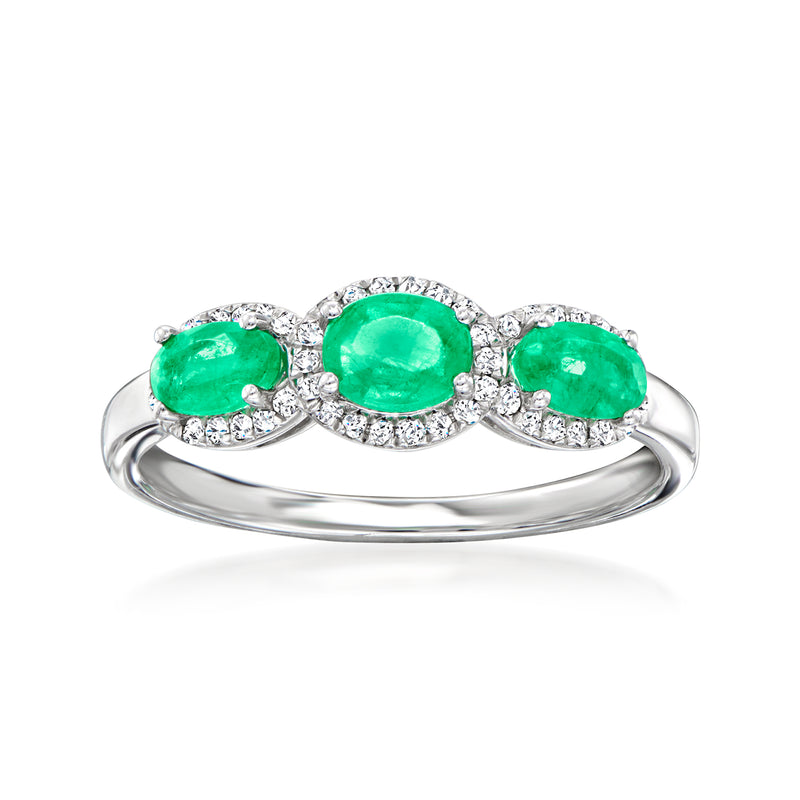 Oval green emerald ring with diamond halos in 14kt white gold band