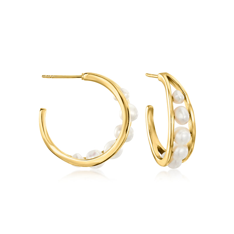 Gold C-hoop earrings with clustered white pearls along the curve