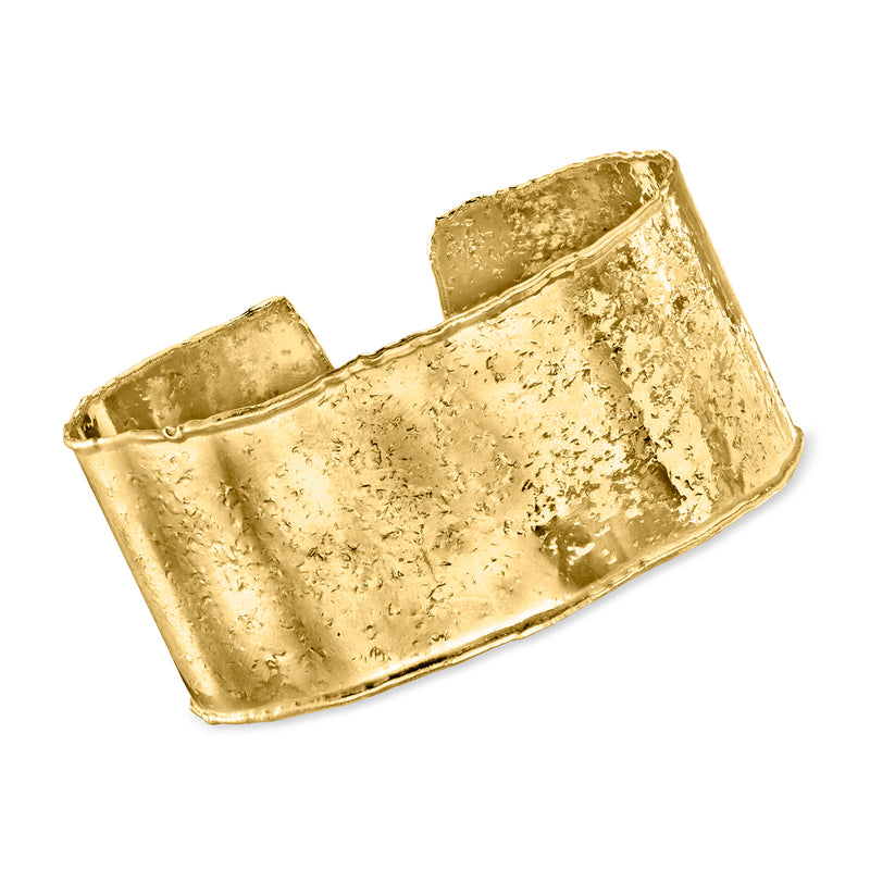 Wide gold-tone textured cuff bracelet with polished edges, open hinge style