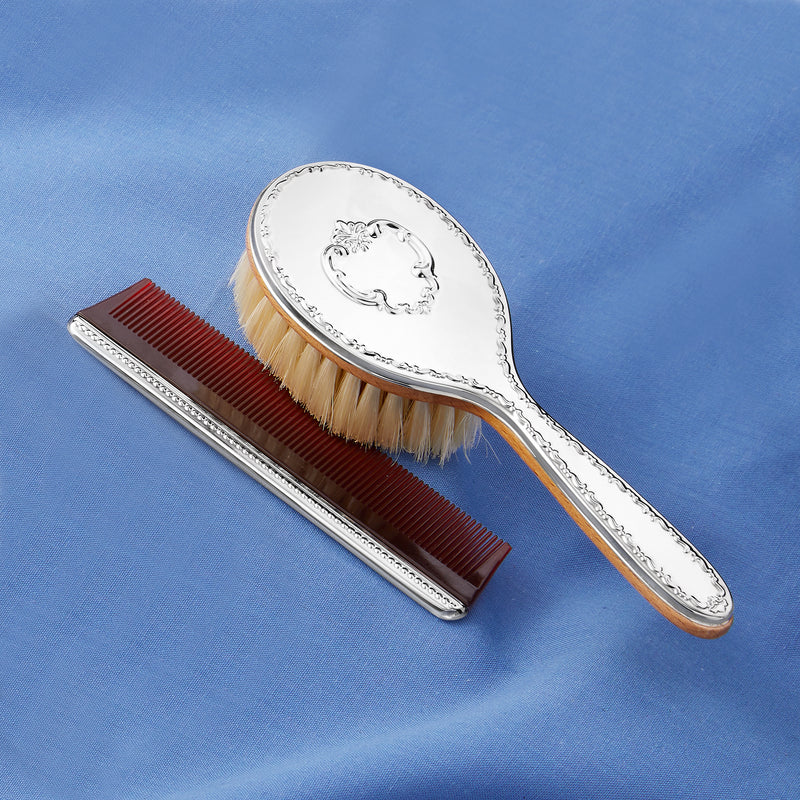 Sterling silver hair brush and comb with red inset bristles and oval crest