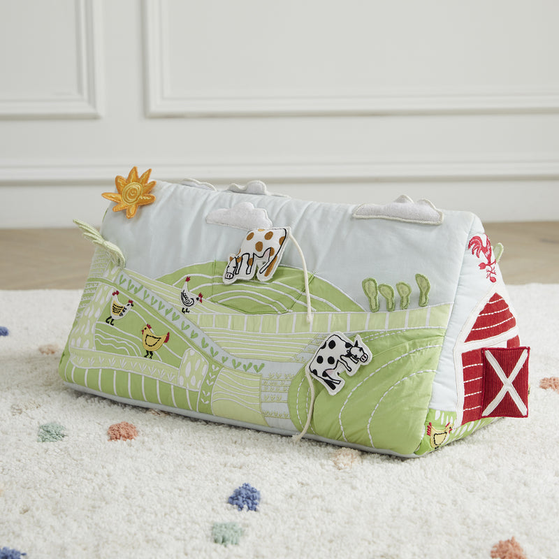 Farm activity tummy time wedge toy with animal prints, quilted panels, and handle strap