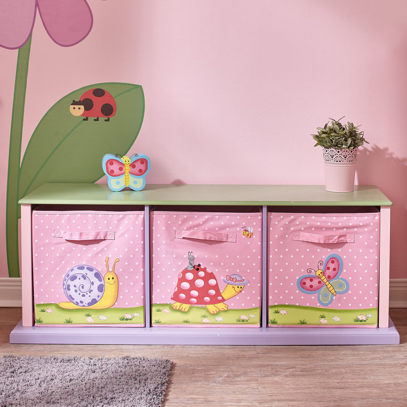 Three-drawer cubby storage unit with pink animal-themed front panels and light purple base