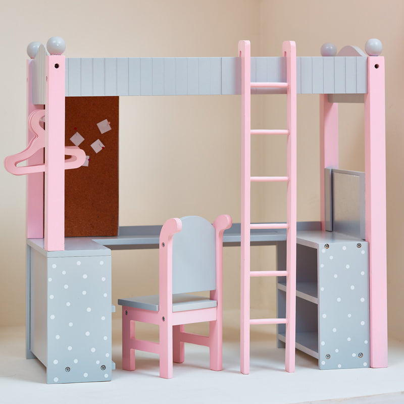 Pink doll loft bed with ladder, chair, and polka-dot storage boxes