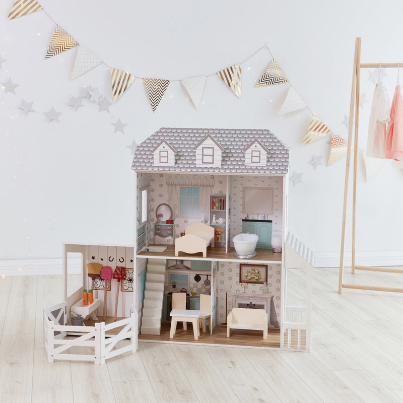 Children's farmhouse dollhouse with gray roof, windows, porch furniture, and pennant garland