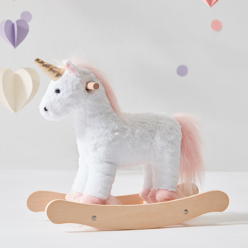 Children's unicorn doll rocking horse with plush white body, pink mane, and wooden rocker