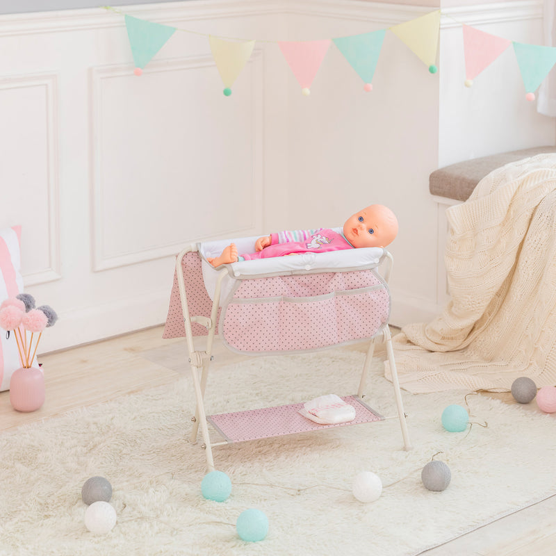 Pink polka-dot baby doll bathtub with white stand and small baby doll