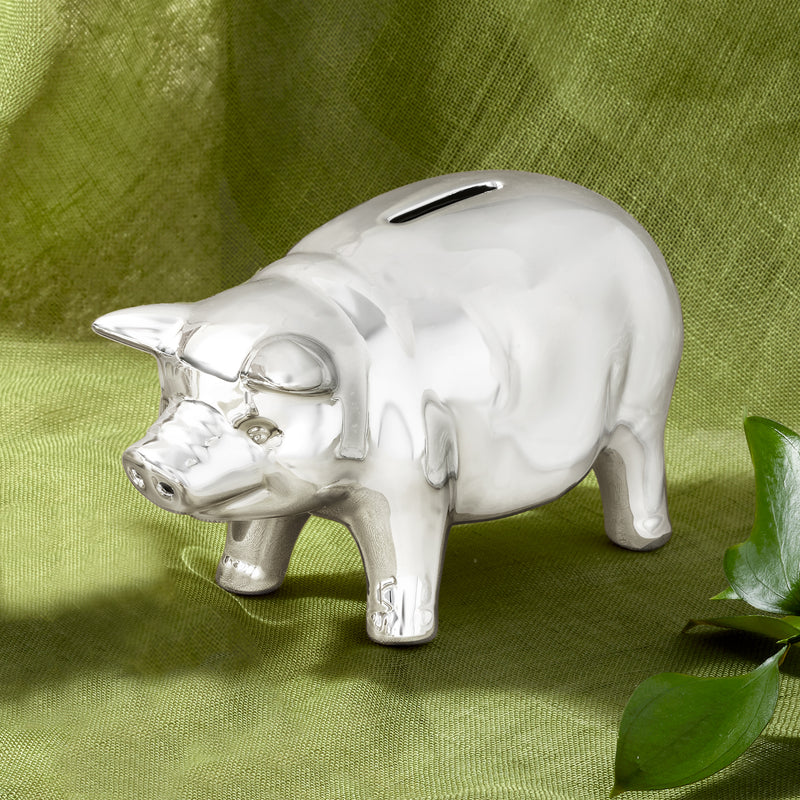 Silver-plated piggy coin bank with snout detail and side coin-slot opening.