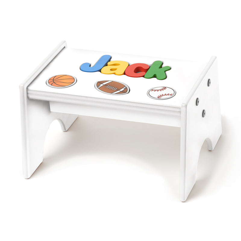 Kids white puzzle stool with sports-themed cutout letters and ball decals on top