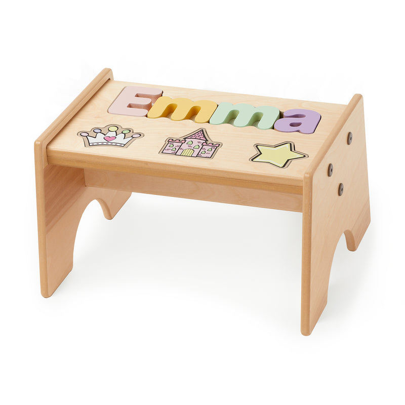 Maple-finished puzzle stool with princess-themed alphabet pieces and pastel cutouts