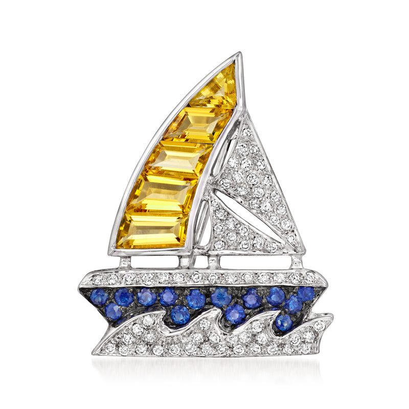 18kt white gold sailboat pin with yellow citrine sail, blue sapphire hull, diamond accents