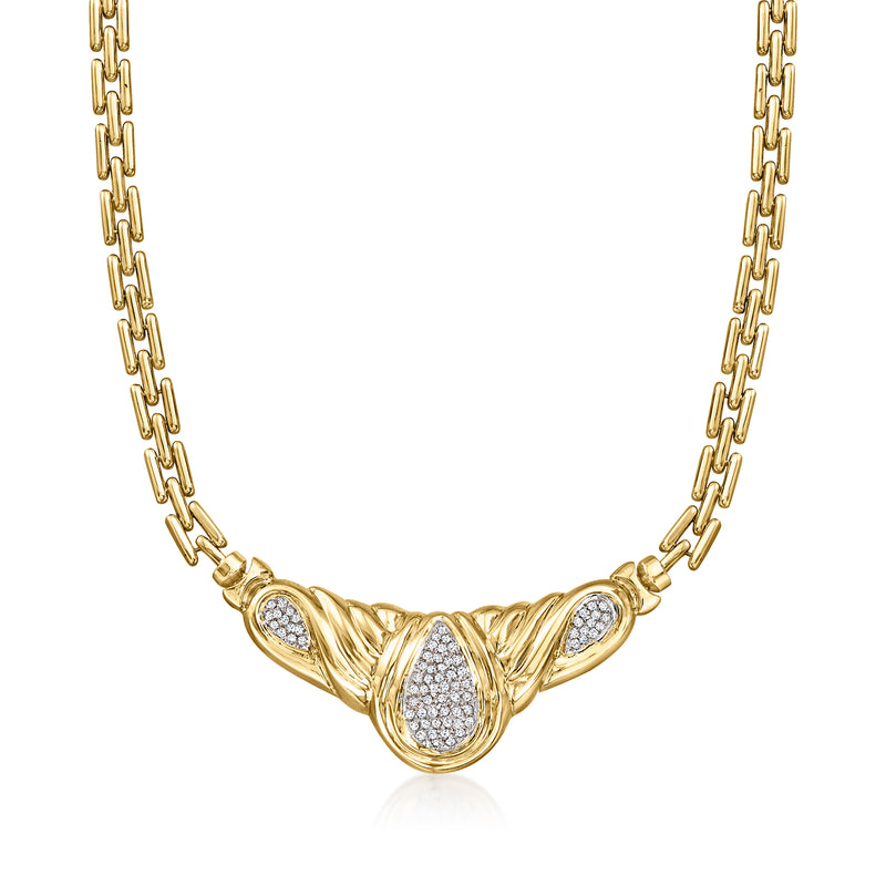 Yellow gold diamond necklace with oval cluster centerpiece and teardrop setting