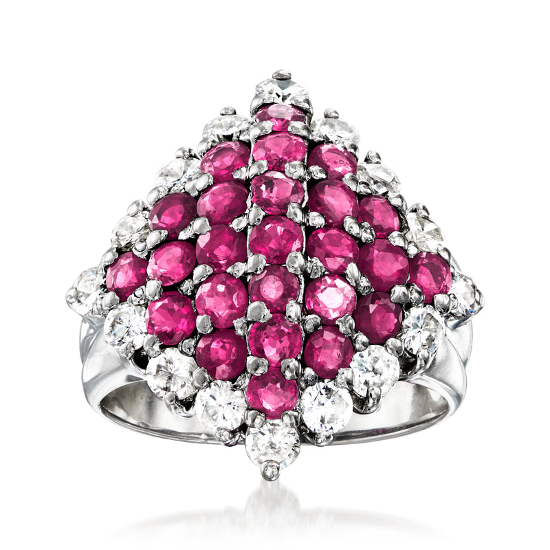 Vintage platinum ring with clustered pink ruby gemstones and round-cut diamond accents