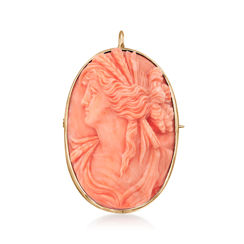Oval pink coral cameo pendant in 14kt yellow gold bezel, with top bail loop