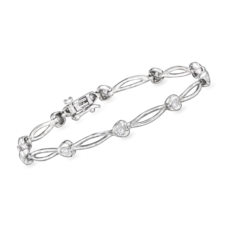 Diamond heart station link bracelet in 14kt white gold with bezel-set stones