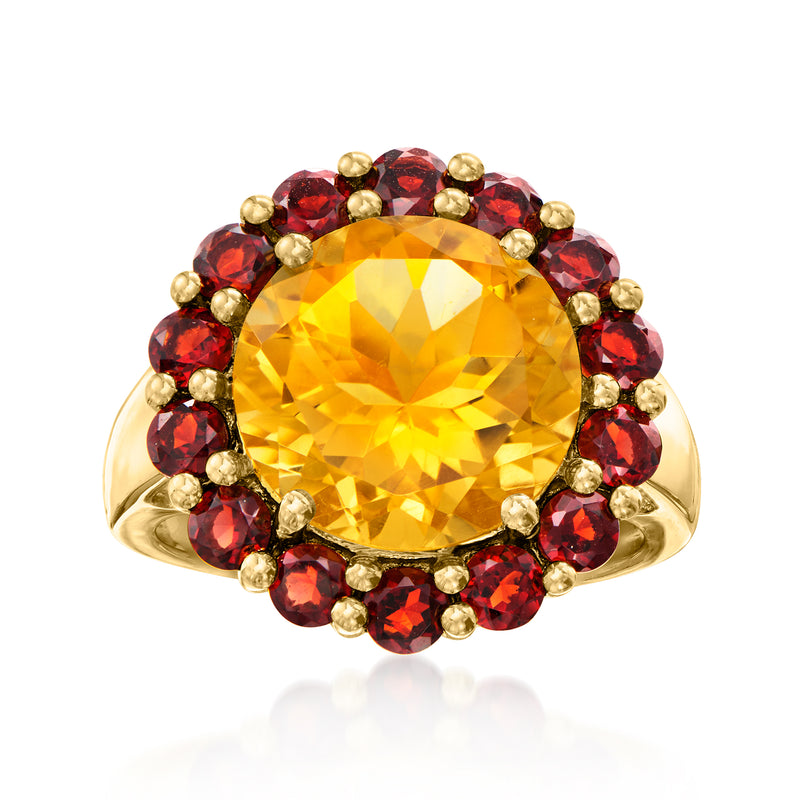 Gold ring with large yellow citrine center and red round garnet halo