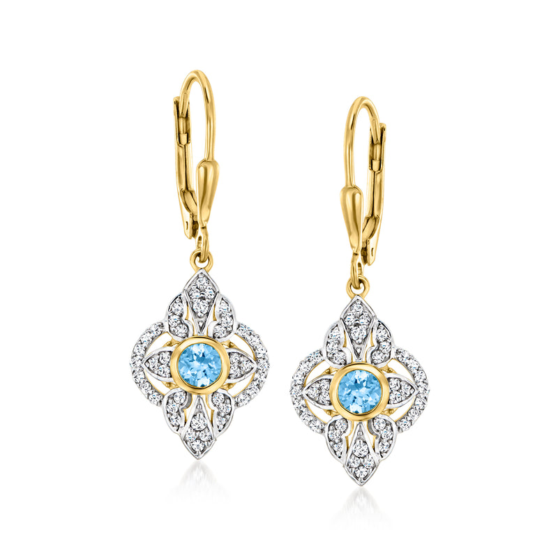 Gold leverback drop earrings with blue topaz center and white stone flower settings