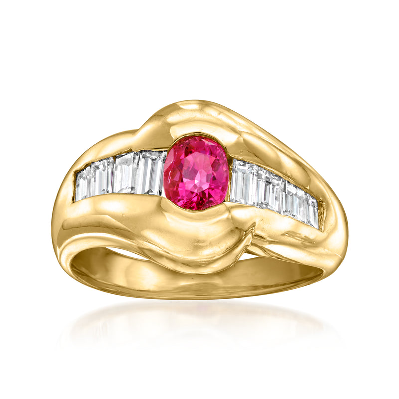 18kt yellow gold ring with pink-red oval ruby center and baguette diamond side stones