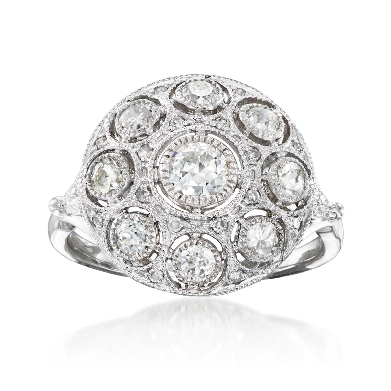 Vintage white gold diamond cluster ring with round center stone and halo of smaller diamonds