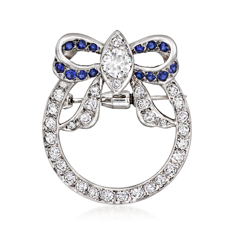 14kt white gold diamond bow pin with sapphire accents and circular halo setting
