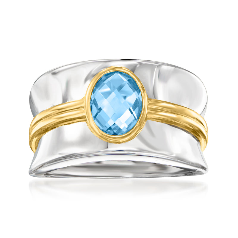 Sterling silver ring with oval blue topaz and gold-tone wrap bezel