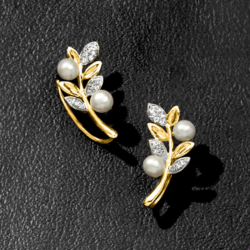 Close-up: yellow gold cultured pearl and diamond leaf ear climber earrings with earwire