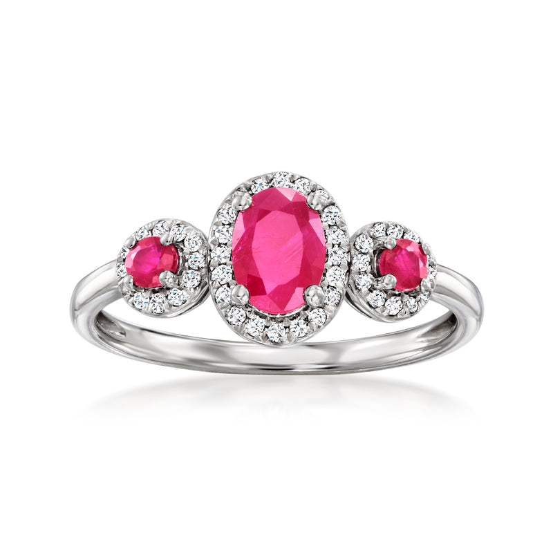 14kt white gold ring with oval pink ruby center, diamond halo, side ruby accents