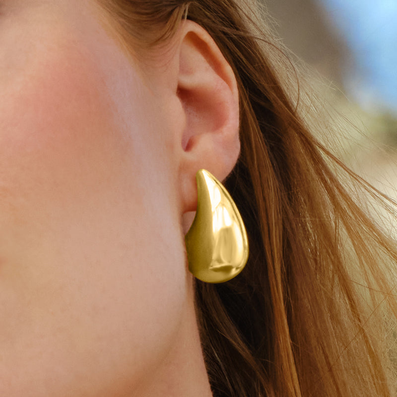 14kt yellow gold teardrop drop earring, curved polished teardrop on a stud post