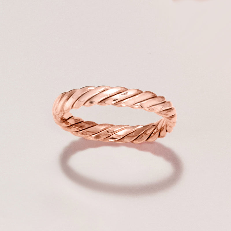 Rose gold twisted band ring with braided detail, top view