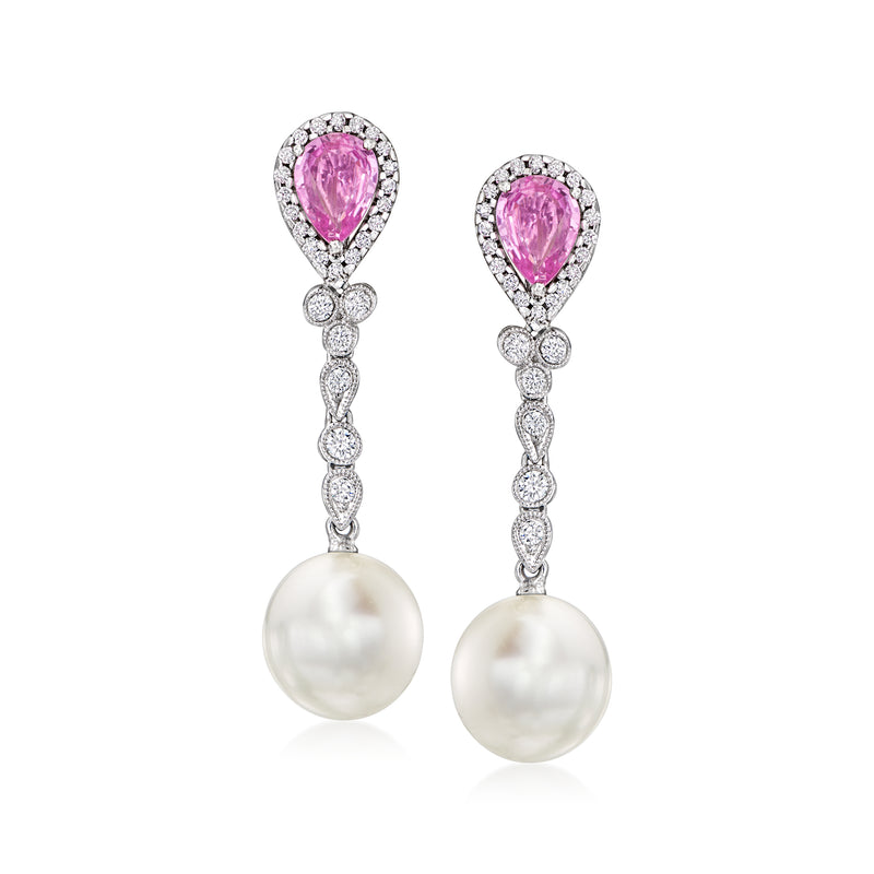 White gold drop earrings with pink pear sapphire, diamond halos, and white cultured pearl