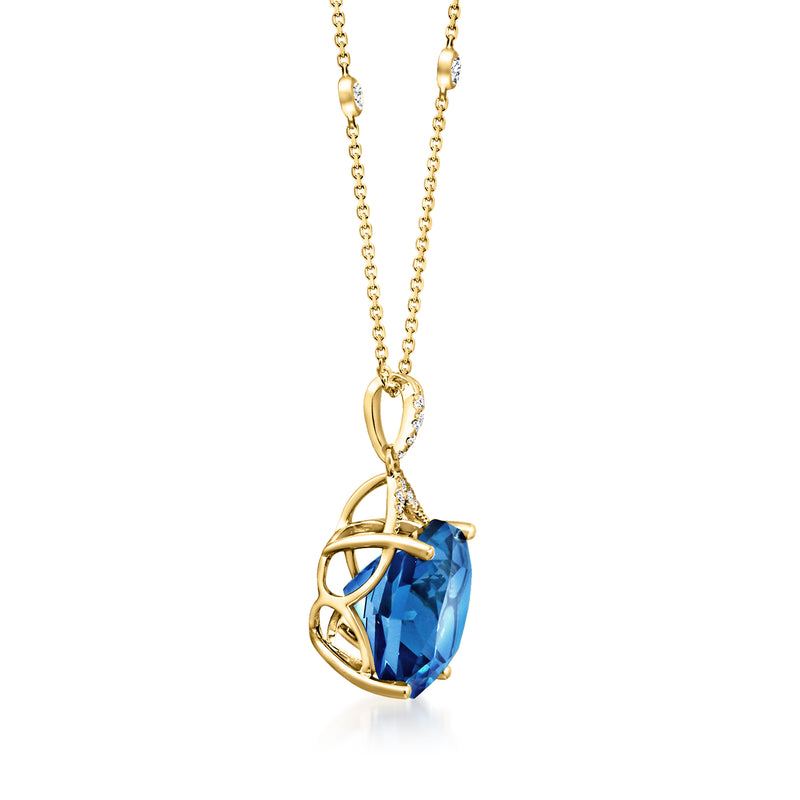 14kt yellow gold pendant necklace with blue topaz, diamond accents, and open prong setting