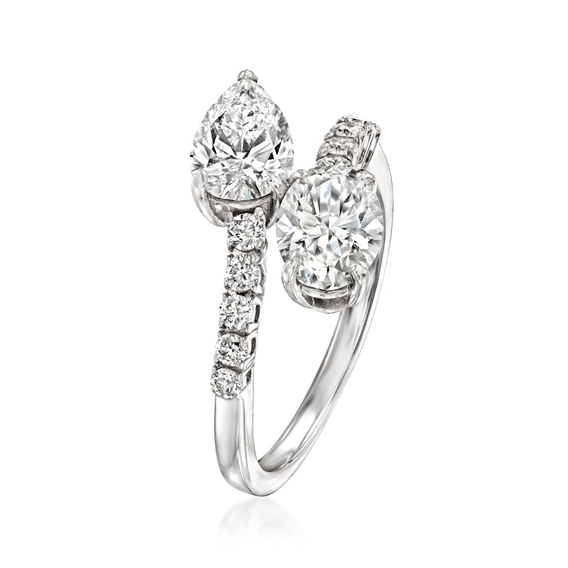 White gold toi et moi bypass diamond ring, side view with oval stones and pave details