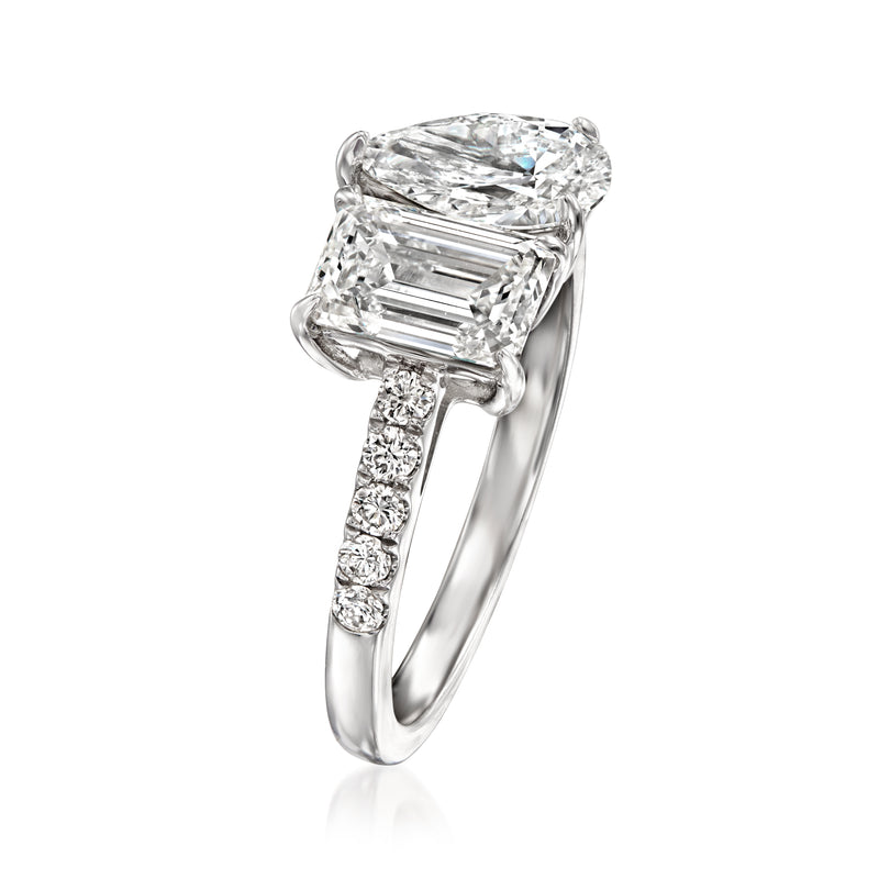 White gold toi et moi diamond ring, emerald-cut center with pear-cut stone atop, side stones