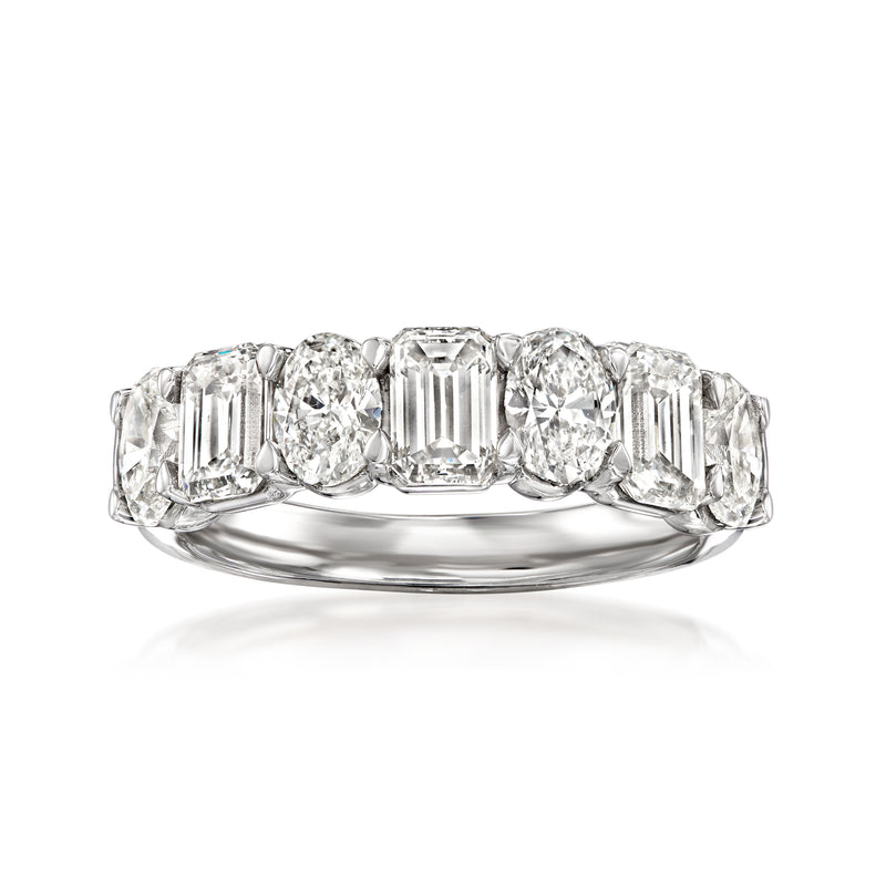 14kt white gold diamond ring with oval center and emerald-cut side stones