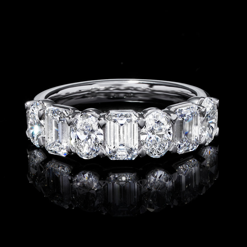 14kt white gold diamond ring with oval center and emerald-cut stones, front view