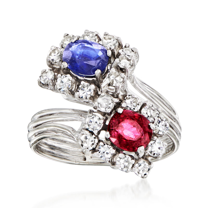 18kt white gold multi-gemstone bypass ring with blue and red stones in diamond halos