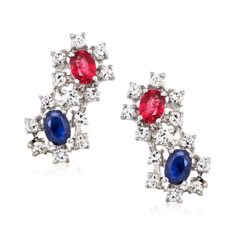 18kt white gold clip/post earrings with oval red ruby and blue sapphire, haloed by diamonds