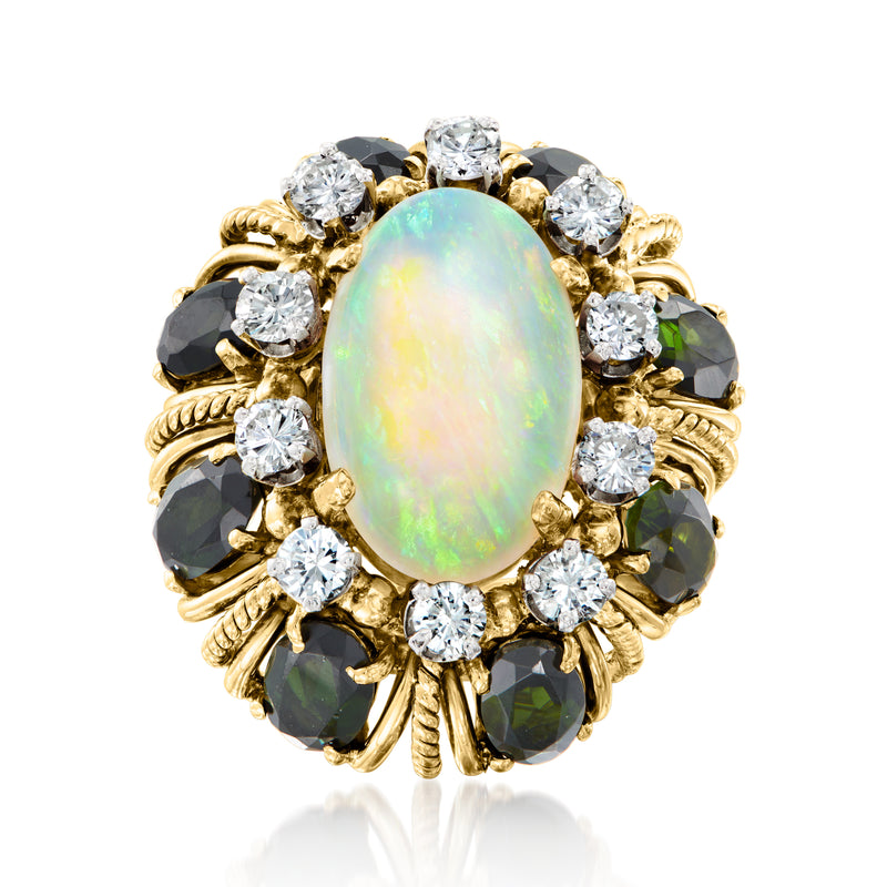 Vintage yellow gold ring with oval opal, round diamonds, and dark gemstone halo