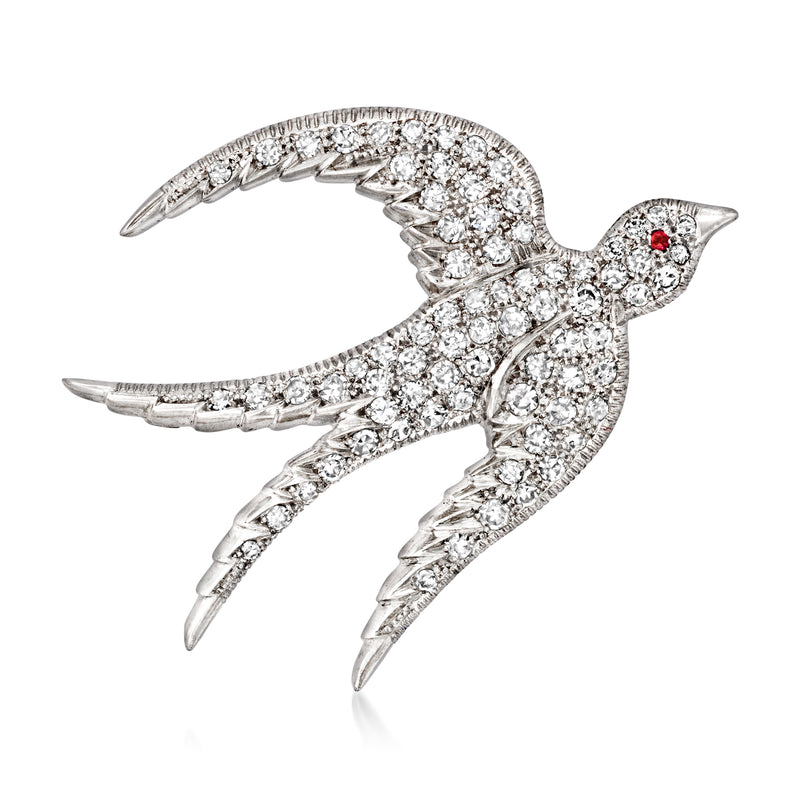 Diamond-studded bird pin with red ruby eye and ribbon-like wings
