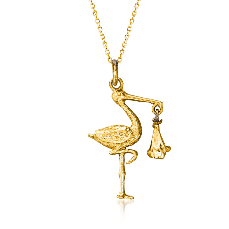 Vintage yellow gold stork pendant necklace with small hanging baby charm
