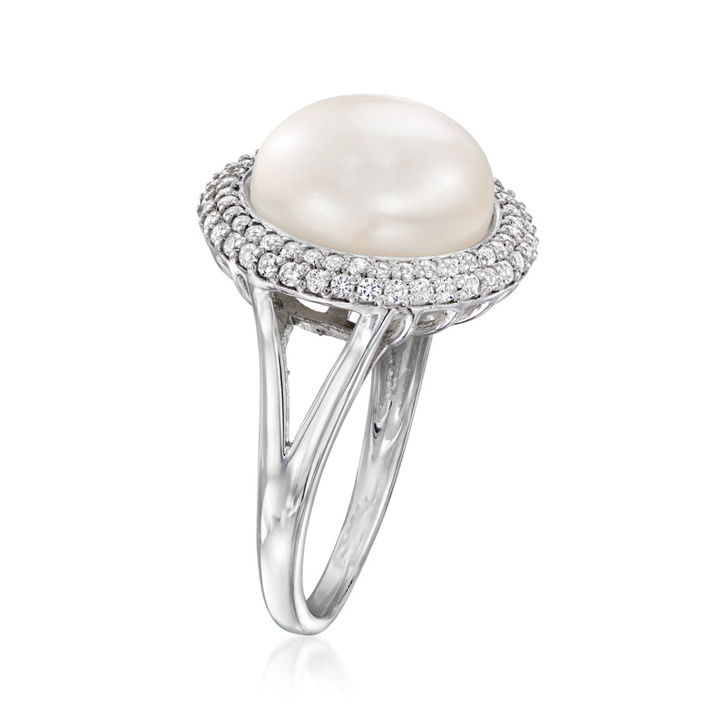 Sterling silver ring with white cultured pearl top, prongs, and round stone band