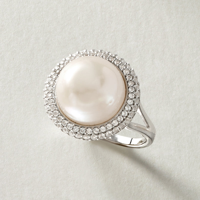 Sterling silver ring with white cultured pearl center and double row round stone halo