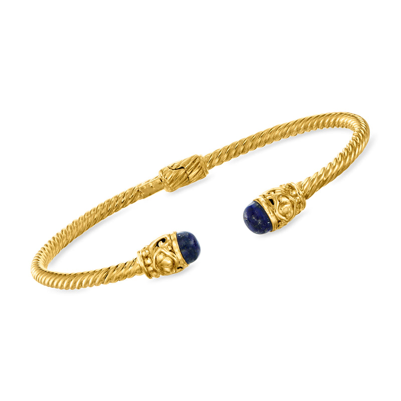 Twisted gold-tone bracelet with blue lapis oval cabochons and clasp detail