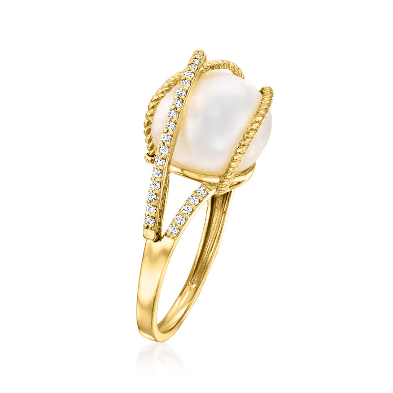 14kt yellow gold ring, oval pearl held by rope bezel with side diamond accents