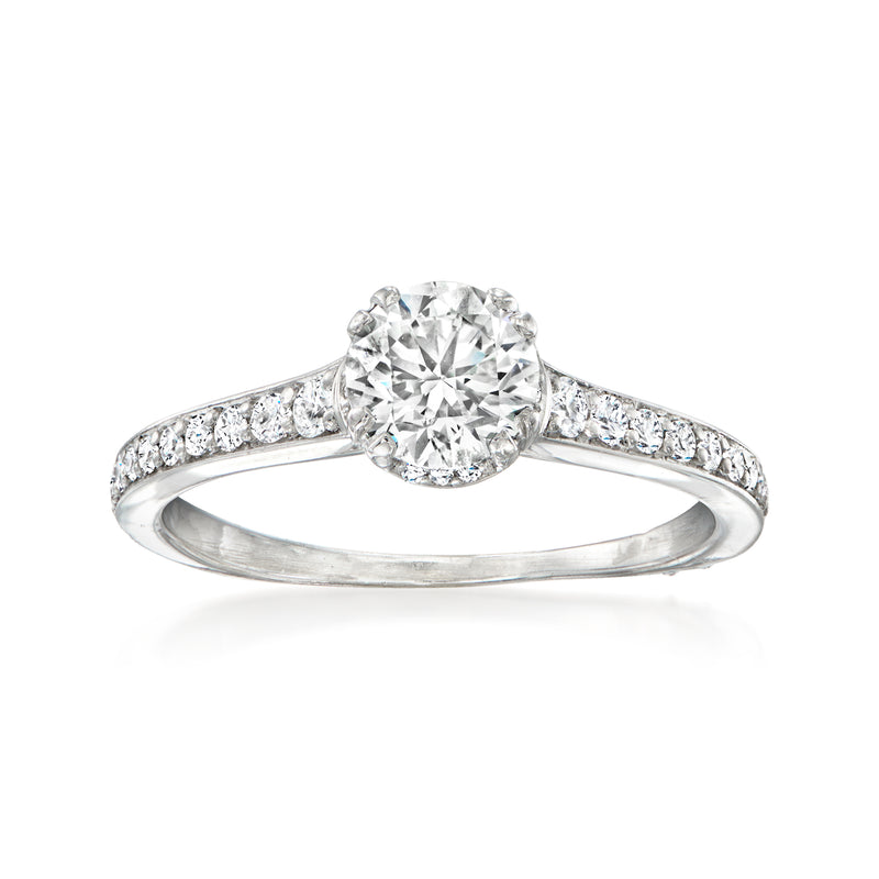 Platinum vintage diamond ring with round center stone and pave side diamonds