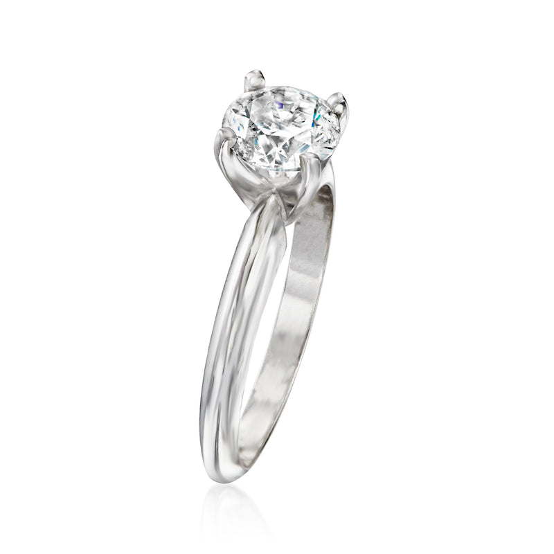White gold solitaire ring with round center diamond and curved band