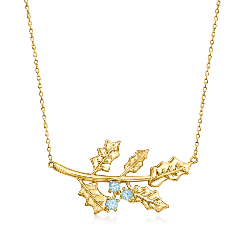 14kt yellow gold holly flower necklace with blue topaz stones